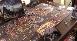 planszówka z figurami i podkładem Westeros ze scenami bitew